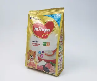 Каша молочна рисова з лісовими ягодами 210 г Milupa Польща